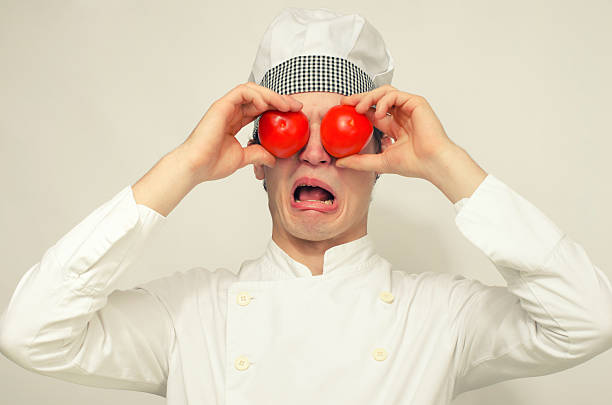 istock Funny chef playing with tomatoes and screaming 186933953