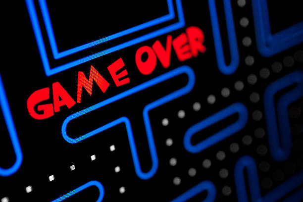 Screen showing that the Game is Over Screen showing that the Game is Over. Macro picture of a video game. arcade photos stock pictures, royalty-free photos & images