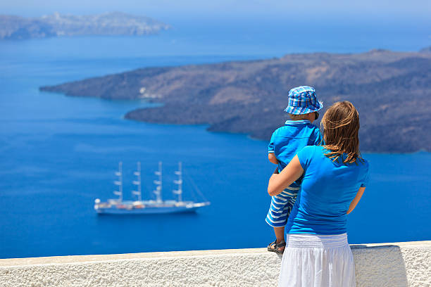 istock family looking at Santorini, Greece 186936888