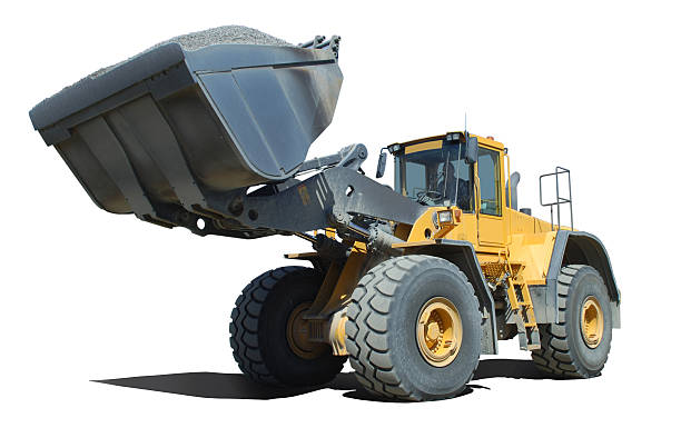 Wheel loader at work Isolated wheel loader with a operating weight of 71 000 lb or 32 000 kg. construction truck bulldozer wheel stock pictures, royalty-free photos & images
