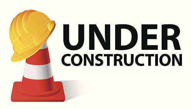 UNDER CONSTRUCTION Yellow safety cap worker on red cone. Under construction concept. Vector illustration hard hat stock illustrations