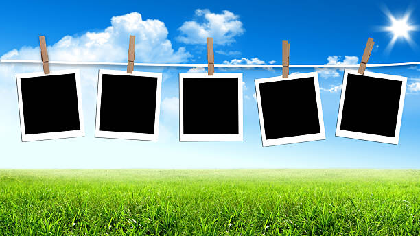 istock Photos frames hanging in the rope on a sky 186937457