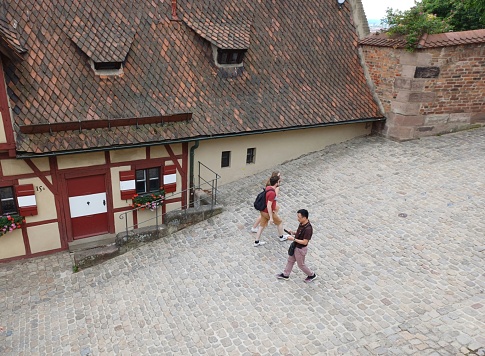 Nuremberg, Germany - June 10, 2023: Tourists enjoy sightseeing at Nuremberg old town, Germany.