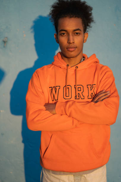istock A man wearing an orange sweatshirt 1869410532