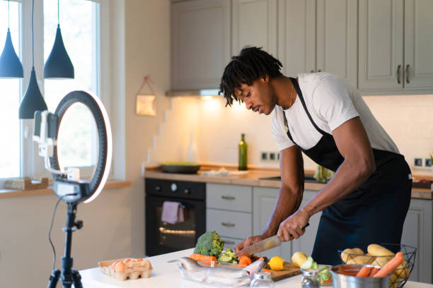 istock African-American man holding a cooking webinar 1869413234