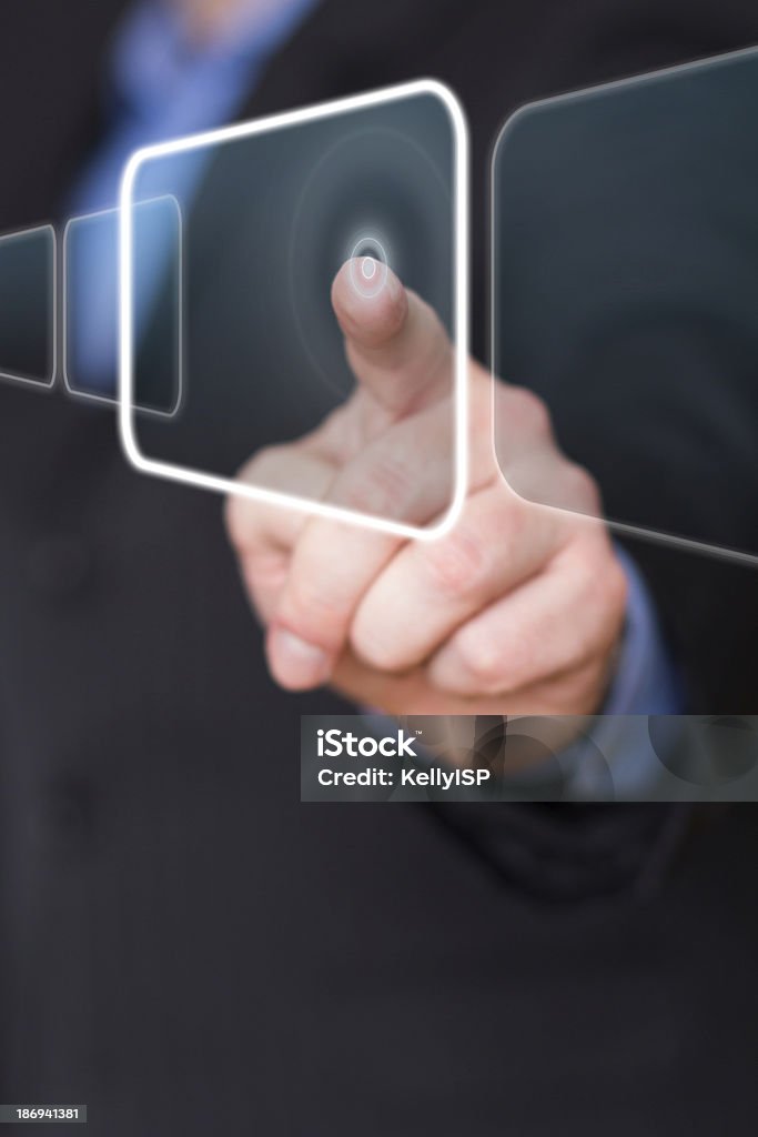 Businessman pushing the interface button Businessman in black suit pushing the interface button in virtual reality Adult Stock Photo