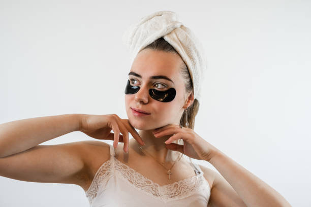 istock young woman with hydrogel eye patches isolated on white 1869414836