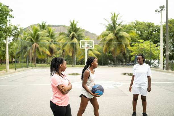 istock Playing basketball in a public park 1869415912