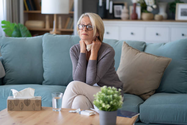 istock Thoughtful woman sitting on couch 1869419642