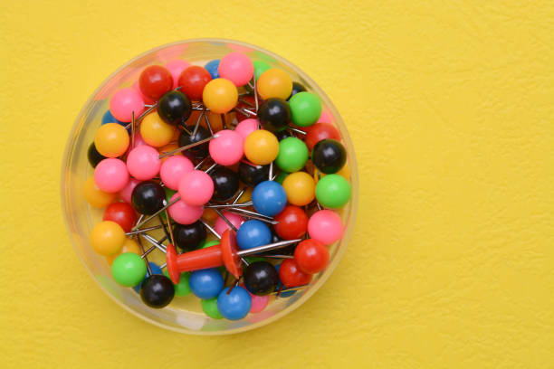 Red thumbtacks on isolated white background. Horizontal composition.