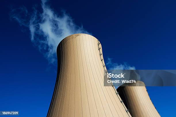 Cooling Towers Of Nuclear Power Plant Against Blue Sky Stock Photo - Download Image Now