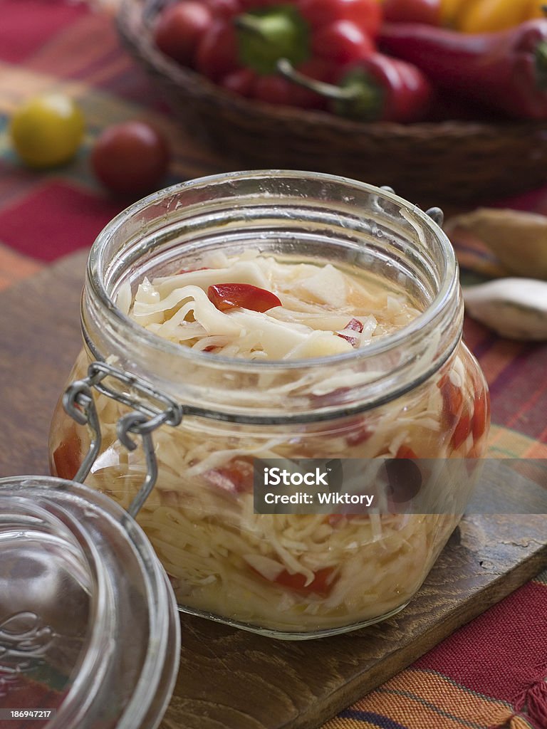 Marinated cabbage (sauerkraut) Marinated cabbage (sauerkraut) in glass jar, selective focus Cabbage Stock Photo