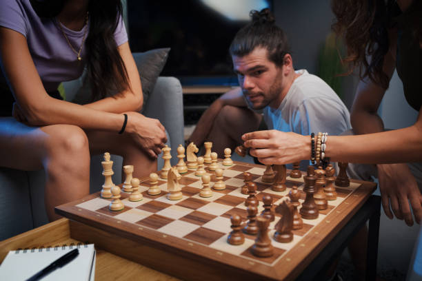 istock Friends playing chess at home 1869473023