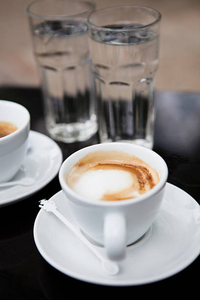 istock Two cups of coffee and water 186951363