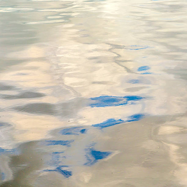 istock reflection of sky and clouds in the ocean 186951806