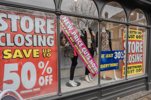 Nantwich, Cheshire, England, January 22 2023. M And Co shop window with sale and store closing display, retail and business editorial illustration.