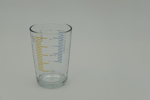 Measuring glass on a white background
