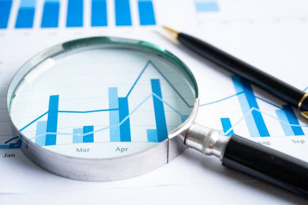 istock Magnifying glass on graph paper. Financial development, Banking Account, Statistics, Investment Analytic research data economy, Business concept. 1869544592