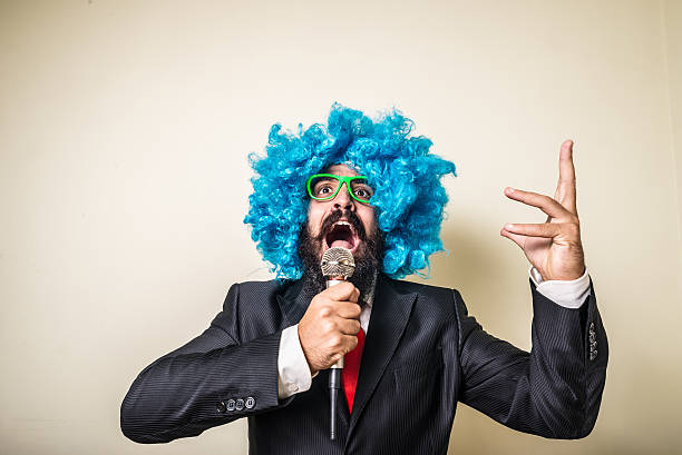 crazy funny bearded man with blue wig stock photo