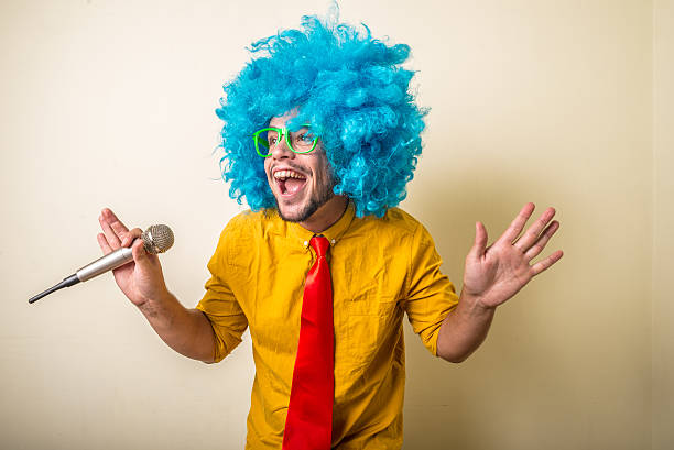 istock crazy funny young man with blue wig 186957144