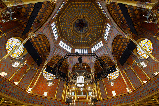 Budapest, Hungary - December 10, 2023: interior wide angle view of Rumbach Street Synagogue zsinagóga architecture.