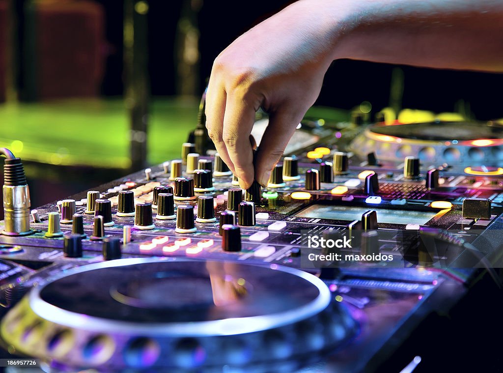 Dj mixes the track Dj playing the track in nightclub at party Arts Culture and Entertainment Stock Photo