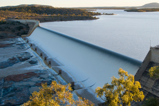Burdekin Dam (Lake Dalrymple) is located on the Burdekin River in Queensland, Australia. The dam provides drinking water for twin cities of Thuringowa and Townsville, as well as a large irrigation scheme. The dam wall is 876 metres long, has a 504 metre spillway and a drop of 37 metres.