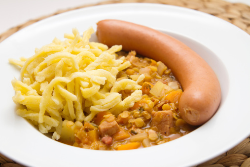Lentils with spaetzle (noodles) and frankfurter sausage
