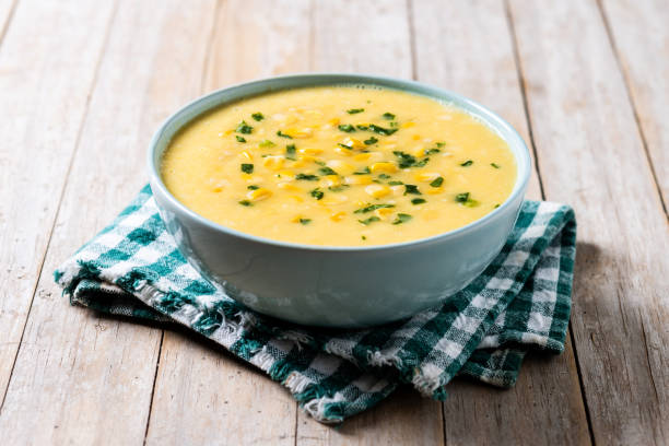 istock Corn soup in green bowl on wooden table 1869588017