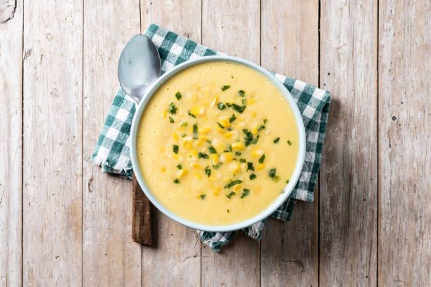 istock Corn soup in green bowl on wooden table 1869589552