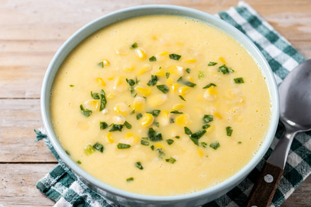istock Corn soup in green bowl on wooden table 1869590066