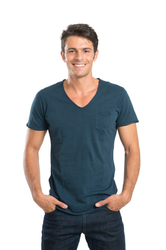 Portrait Of Smiling Man With Hand In Pockets Isolated On White Background.