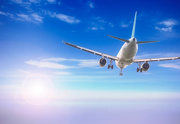 istock plane flying in the sunset bluesky 186960114