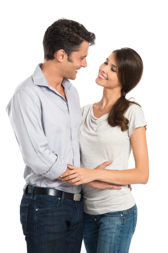 Portrait Of A Embracing Couple Looking At Each Other Isolated On White Background.