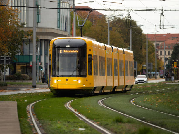 Dresden, Articulated railcar NGT DX DD on line 2 to Kleinzschachwitz. The new yellow tram is part of the public transportation in the city. The DVB is running the transport