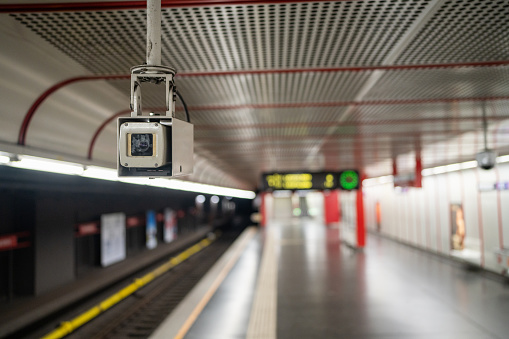 Close-up shot of camera in subway station without people