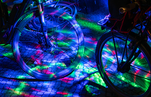 Germany, Berlin, October 11, 2023 - Colorfully illuminated bicycle at night