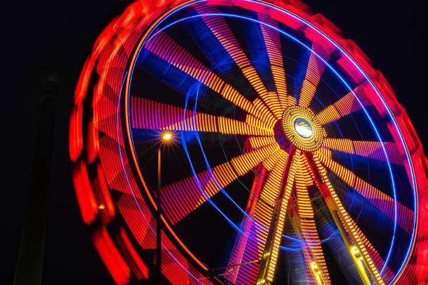 istock Blurred motion of ferris wheel at night 1869609852