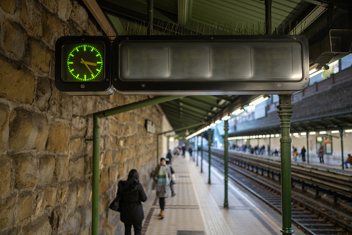 Railway station interior and clock on the platform