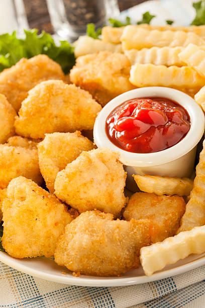 istock Unhealthy Chicken Nuggets and Fries 186963367