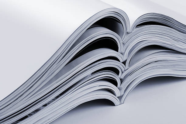 istock Pile of open blank magazines 186963835