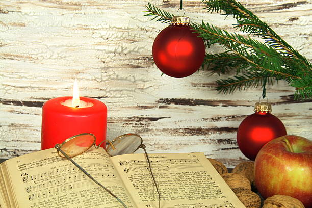 istock old hymnal, Christmas decoration and candle 186964242