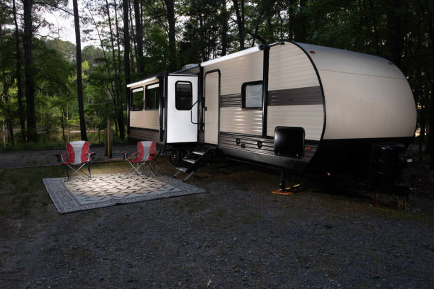 istock Campter trailer next to a lake 1869645120
