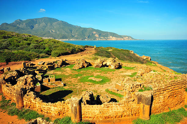Tipaza, Algeria: circular mausoleum by the Mediterranean sea - Tipasa Roman ruins, Unesco World Heritage site - photo by M.Torres