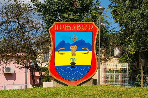 The town coat of arms welcomes people to the town of Prnjavor in the Banja Luka region of Republika Srpska, Bosnia and Herzegovina. The name of the town is spelt out in cyrillic lettering
