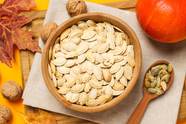 istock Cooking ingredients for fall season - pumpkin seeds, pumpkin 1869665685