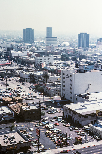 Los Angeles, California, USA - March 2, 1981:  Archival film photograph of smoggy Hollywood streets and building near Highland Ave and Hollywood Blvd.
