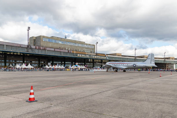 Berlin, Germany - September 23, 2023: A picture of a troop carrier plane at the Tempelhof Airport. The crowd is due to the 2023 Berlin Marathon.