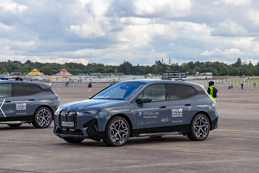 Berlin, Germany - September 23, 2023: A picture of a BMW iX serving as one of the timing cars of the 2023 Berlin Marathon.