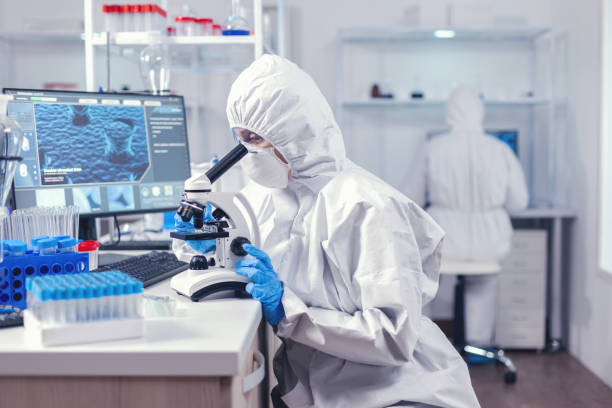 istock Team of scientist working on developing a vaccine for coronavirus 1869680833